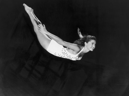 circa 1945:  Portrait of aquatic American actor and swimmer Esther Williams diving through the air in a one-piece swimsuit.  (Photo by Hulton Archive/Getty Images)