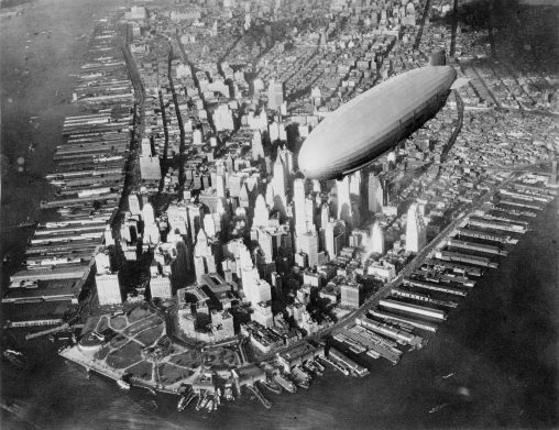 The U.S. Navy airship USS Akron (ZRS-4) flying over the southern end of Manhattan, New York, New York, United States, circa 1931-1933. [Naval History and Heritage Command]