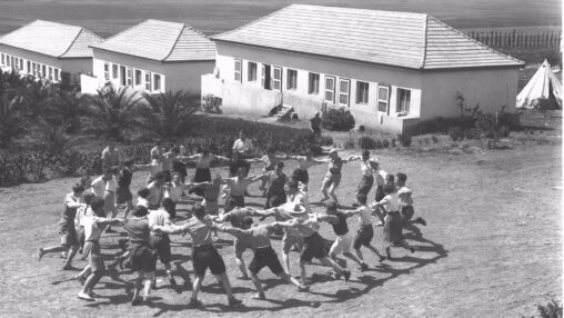 Youth Aliya members from Germany dancing the hora at Kibbutz Ein Harod, 1936.