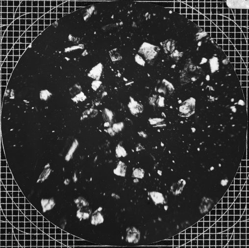 Volcanic dust Mount Soufriere, 1902. Microscope slide showing dust particles. Viewed in plane-polarized light. 
[The Tempest Anderson Photographic Archive, York; Photo by F. Martin Duncan]