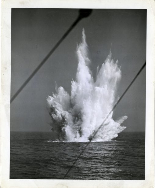Depth charge sends geyser of water high into the air. Circa 1943