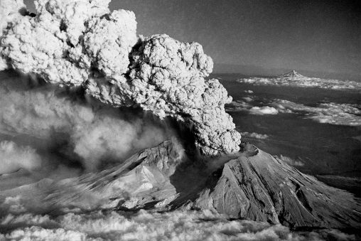 Mount St. Helens Eruption and Mount Hood, Washington, seen during the eruption of May 1980.