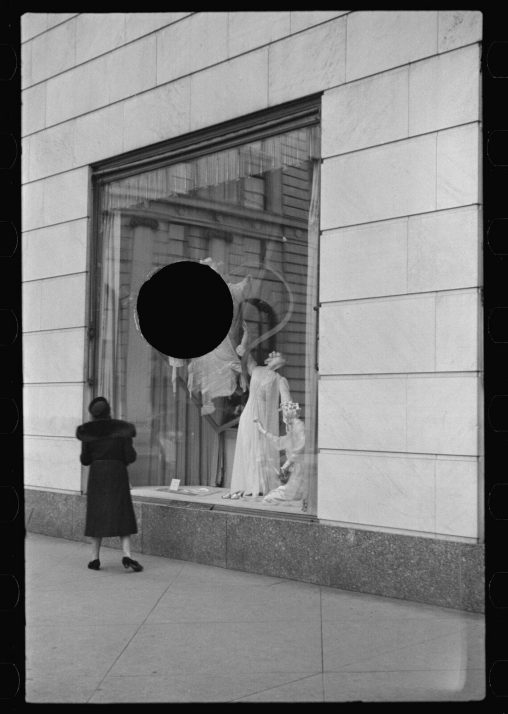 Russell Lee, Untitled photo, possibly related to: Surrealistic, window display, Bergdorf Goodman, New York City, January 1938, 
Photo killed with a hole puncher, resulting in a black hole, 1930’s. Photo killed with a hole puncher, resulting in a black hole, 1930’s.
This photo is part of the Farm Security Administration (FSA) documentary program, setup during the Great Depression, in USA.